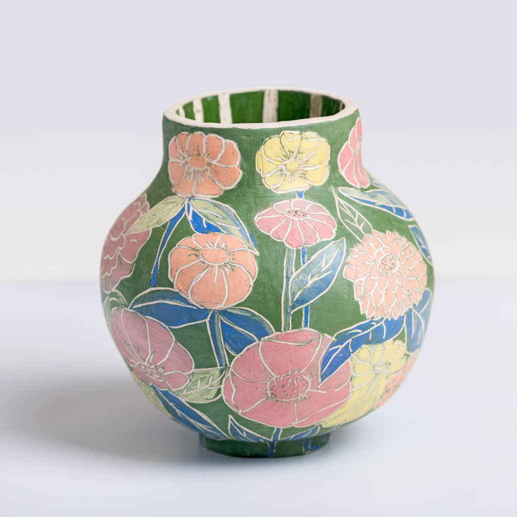 Ceramic vase with colorful flowers on matte green background, handmade and painted in a unique style by Spanish artist Maite Morell.