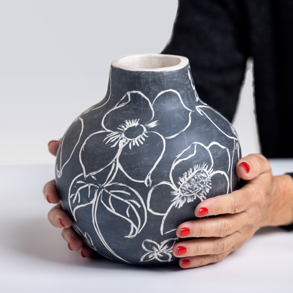 Ceramic vase with exuberant flowers on matte black background, handmade and painted in a unique style by Spanish artist Maite Morell.