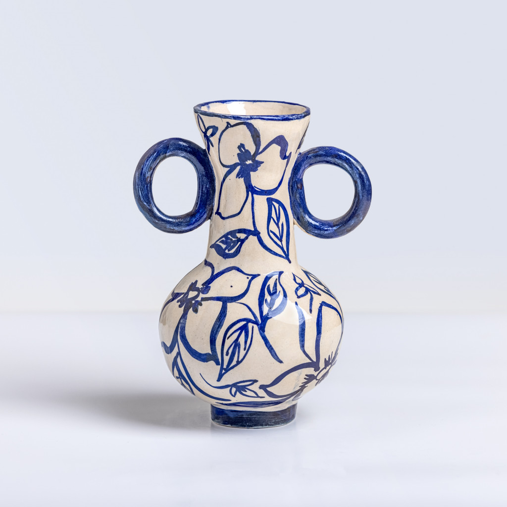 Ceramic vase with blue love flowers on white background, handmade and painted in a unique style by Spanish artist Maite Morell.