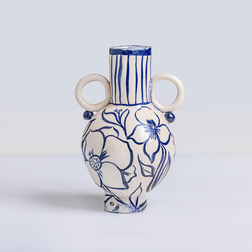 Ceramic vase with blue hollyhocks on white background, handmade and painted in a unique style by Spanish artist Maite Morell.