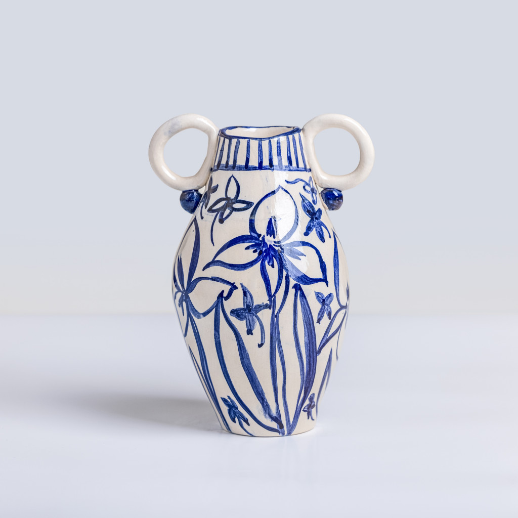 Ceramic vase with blue lilies on white background, handmade and painted in a unique style by Spanish artist Maite Morell.