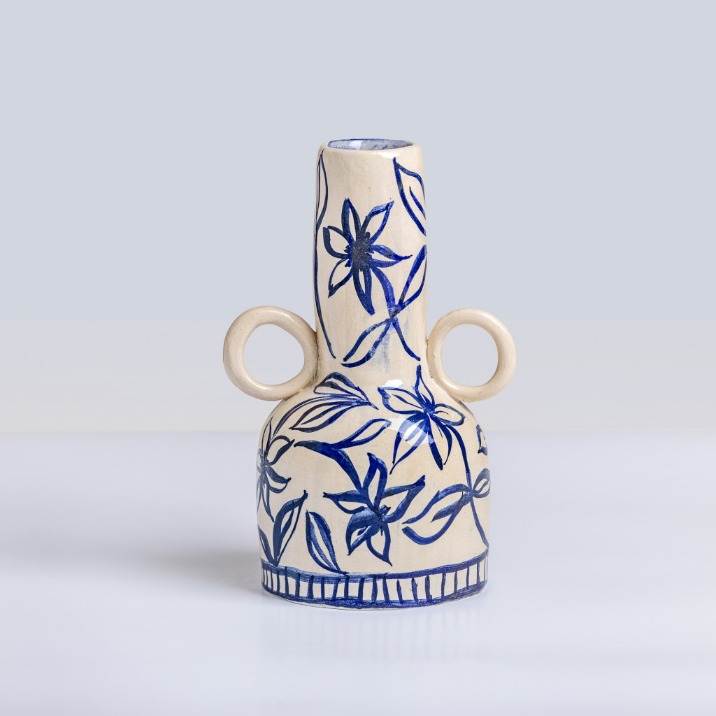 Ceramic vase with blue little flowers on white background, handmade and painted in a unique style by Spanish artist Maite Morell.