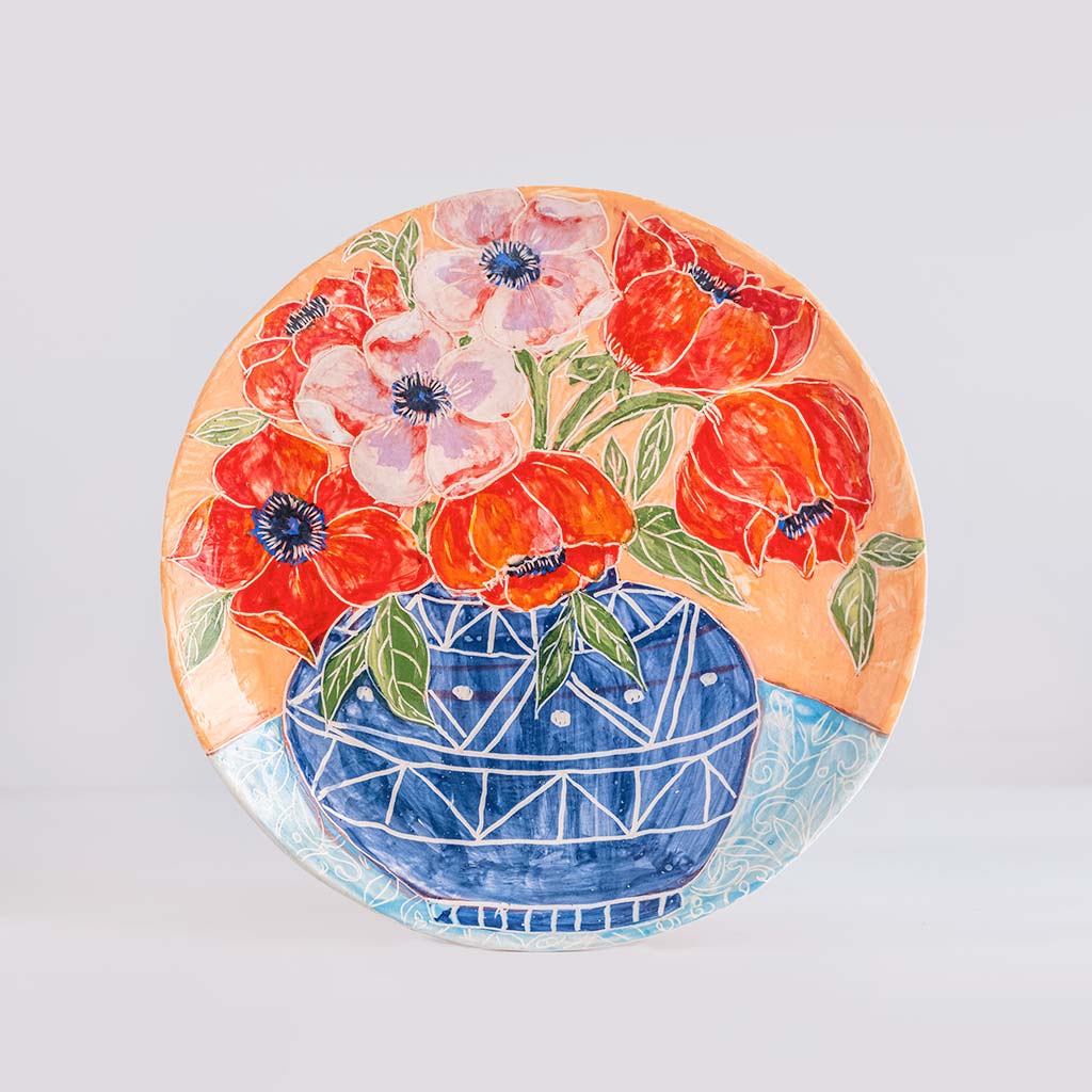 Ceramic decorative plate with anemones in blue vase, handmade and painted in a unique & colourful style by Spanish artist Maite Morell.