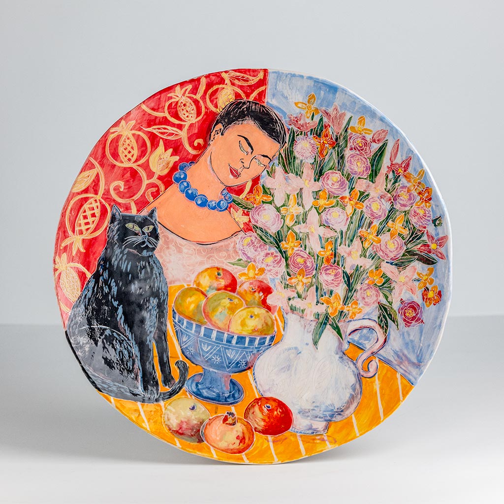 Ceramic decorative plate with self portrait and black cat, handmade and painted in a unique style by Spanish artist Maite Morell.