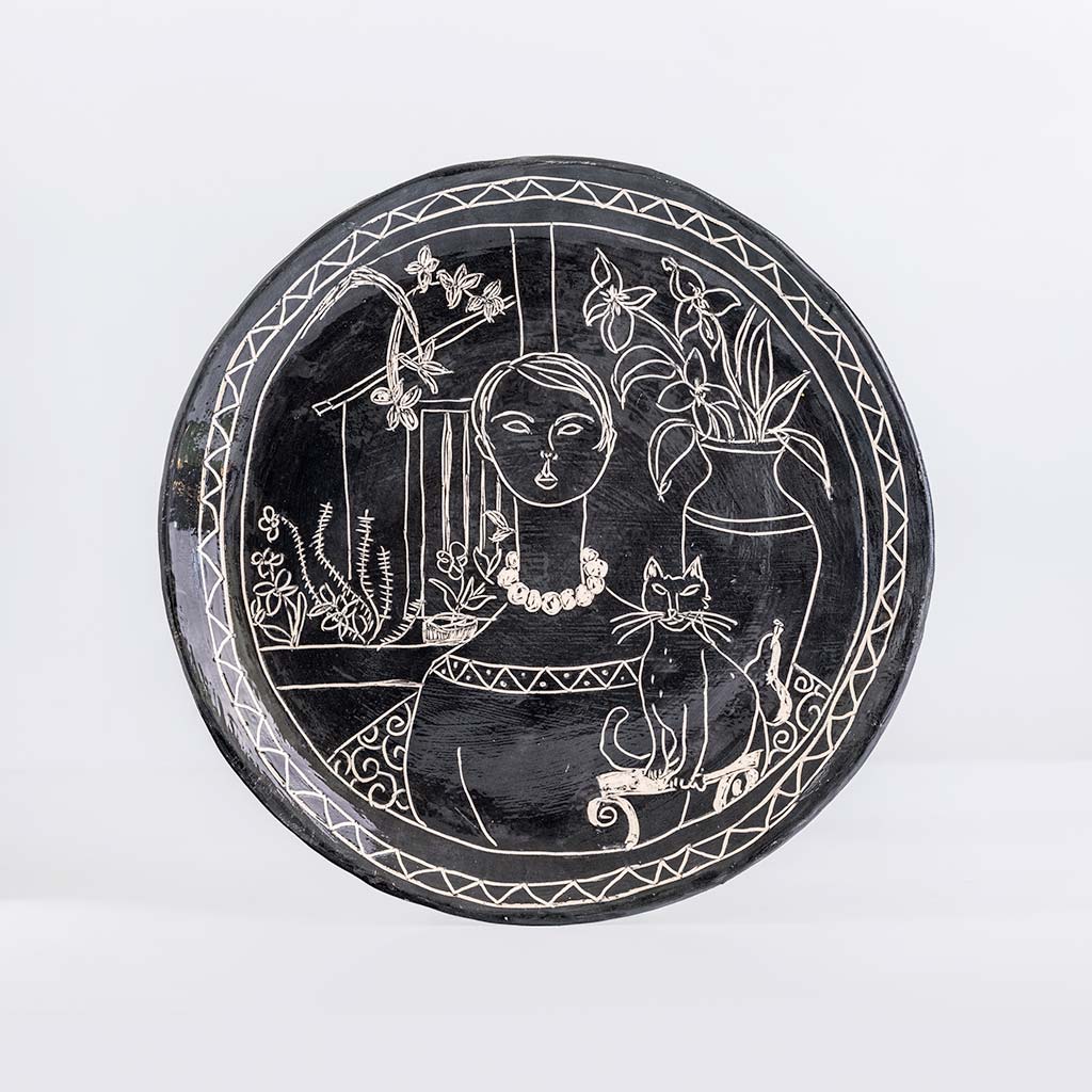 Ceramic decorative plate with self portait with cat, handmade and painted in a unique & colourful style by Spanish artist Maite Morell.