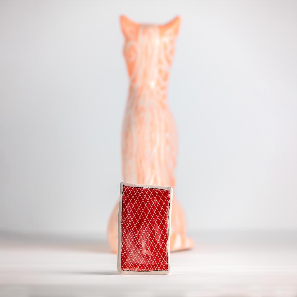 Ceramic sculpture of a cat, handmade and painted in a unique style by Spanish artist Maite Morell.