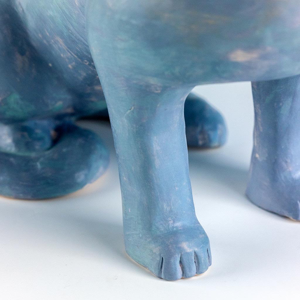 Ceramic sculpture of a cat with a pear, handmade and painted in a unique style by Spanish artist Maite Morell.