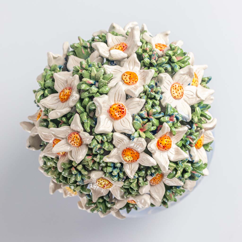 Ceramic still life of a blue vase and white flowers, handmade and painted in a unique & colourful style by Spanish artist Maite Morell.