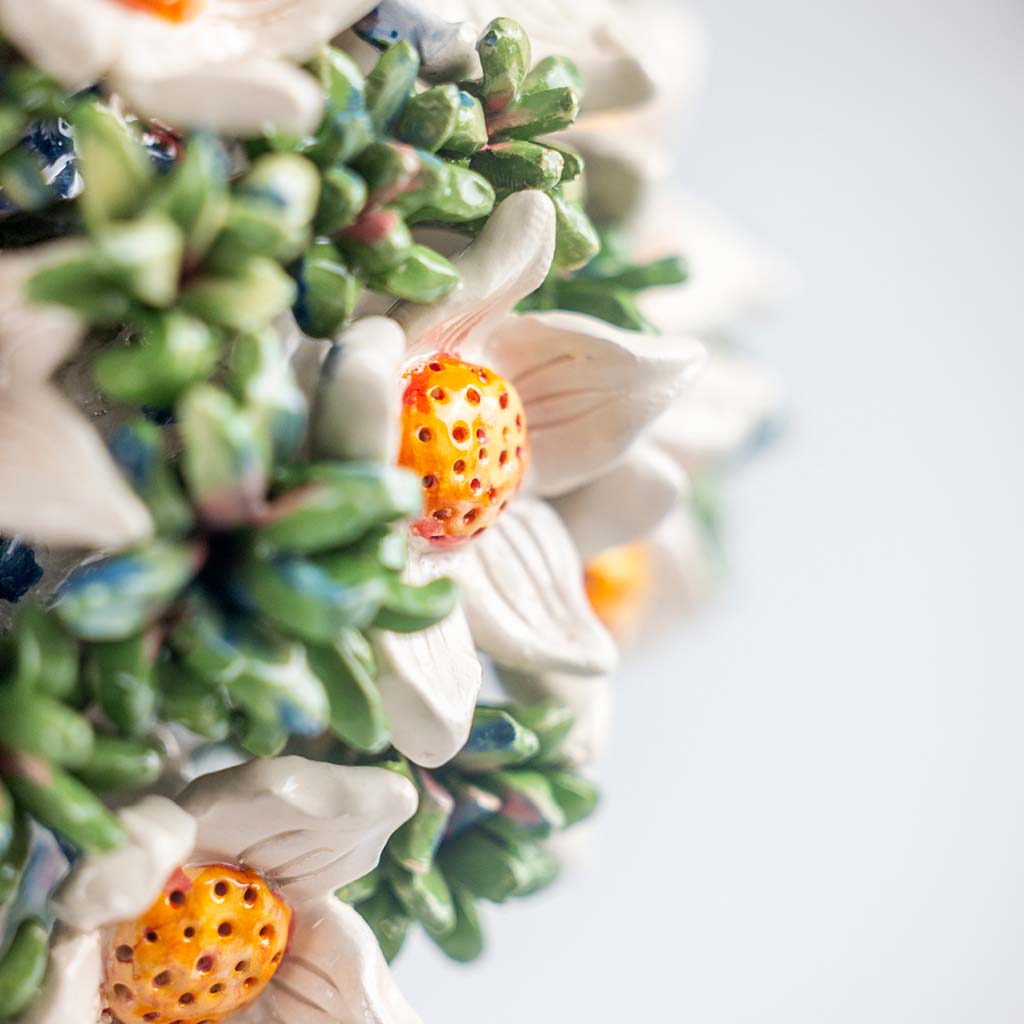 Ceramic still life of a blue vase and white flowers, handmade and painted in a unique & colourful style by Spanish artist Maite Morell.