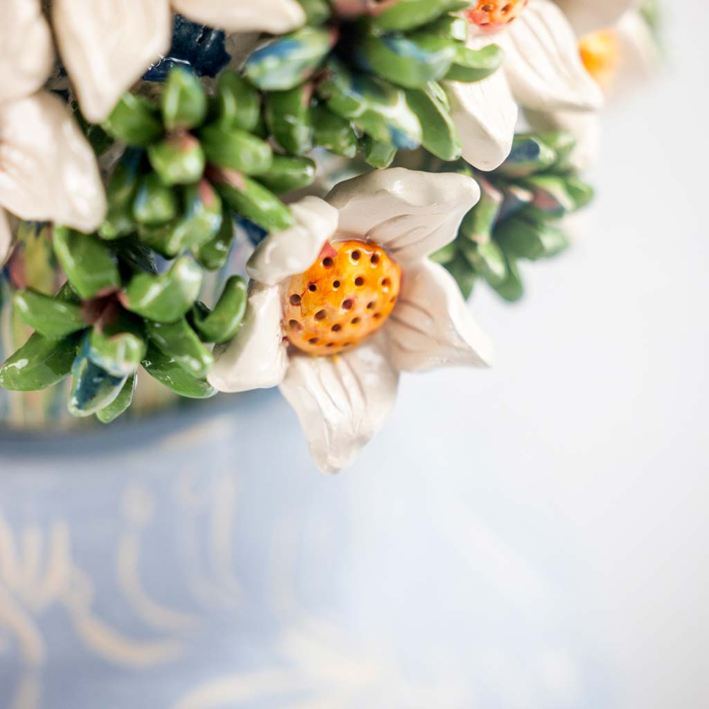 Ceramic still life of a blue vase and white flowers, handmade and painted in a unique & colourful style by Spanish artist Maite Morell.