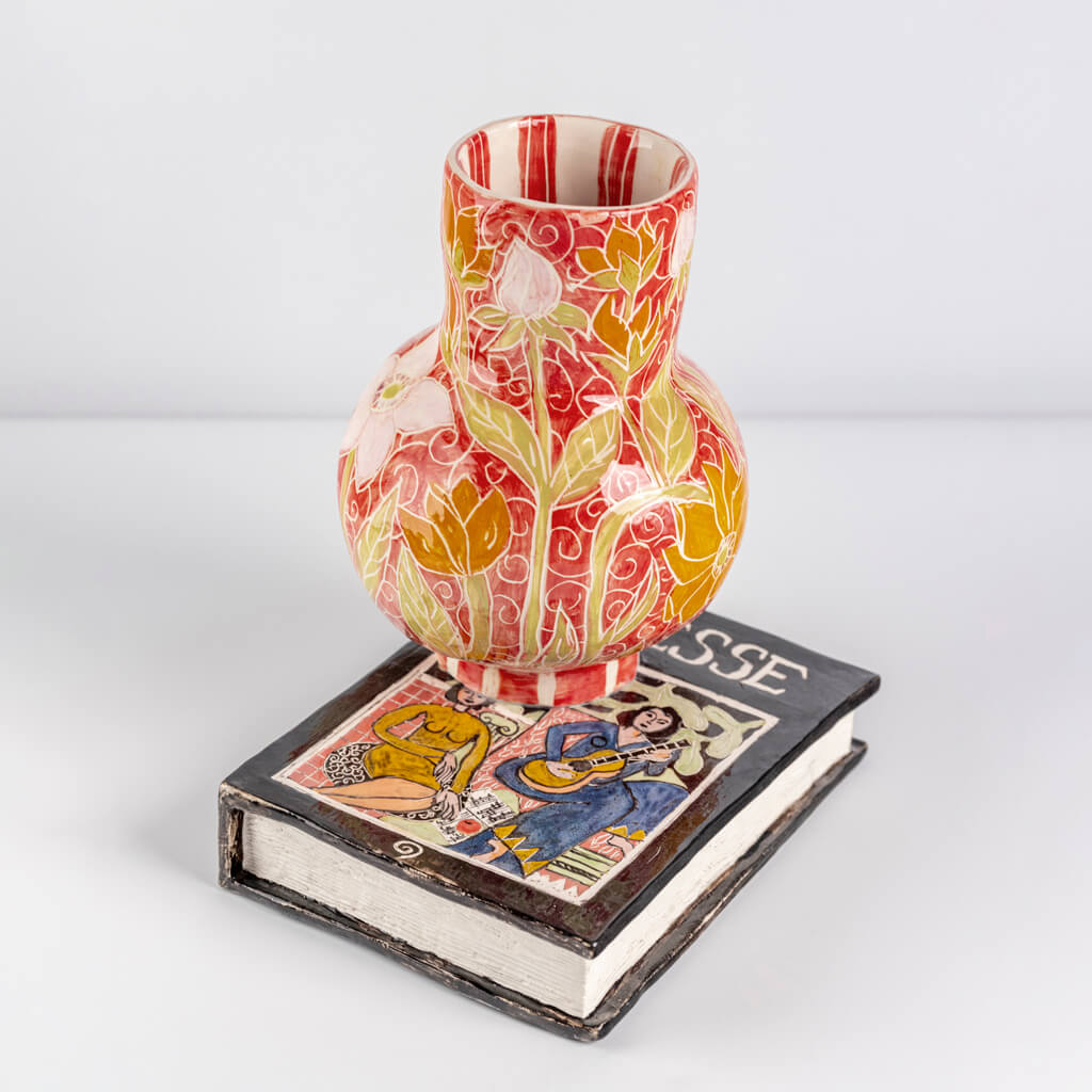 Ceramic still life of a book of Matisse with red vase, handmade and painted in a unique & colourful style by Spanish artist Maite Morell.