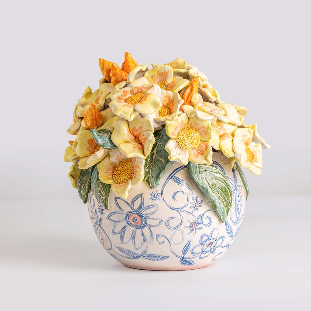 Ceramic still life of a vase with bouquet of white flowers, handmade and painted in a unique & colourful style by Spanish artist Maite Morell.
