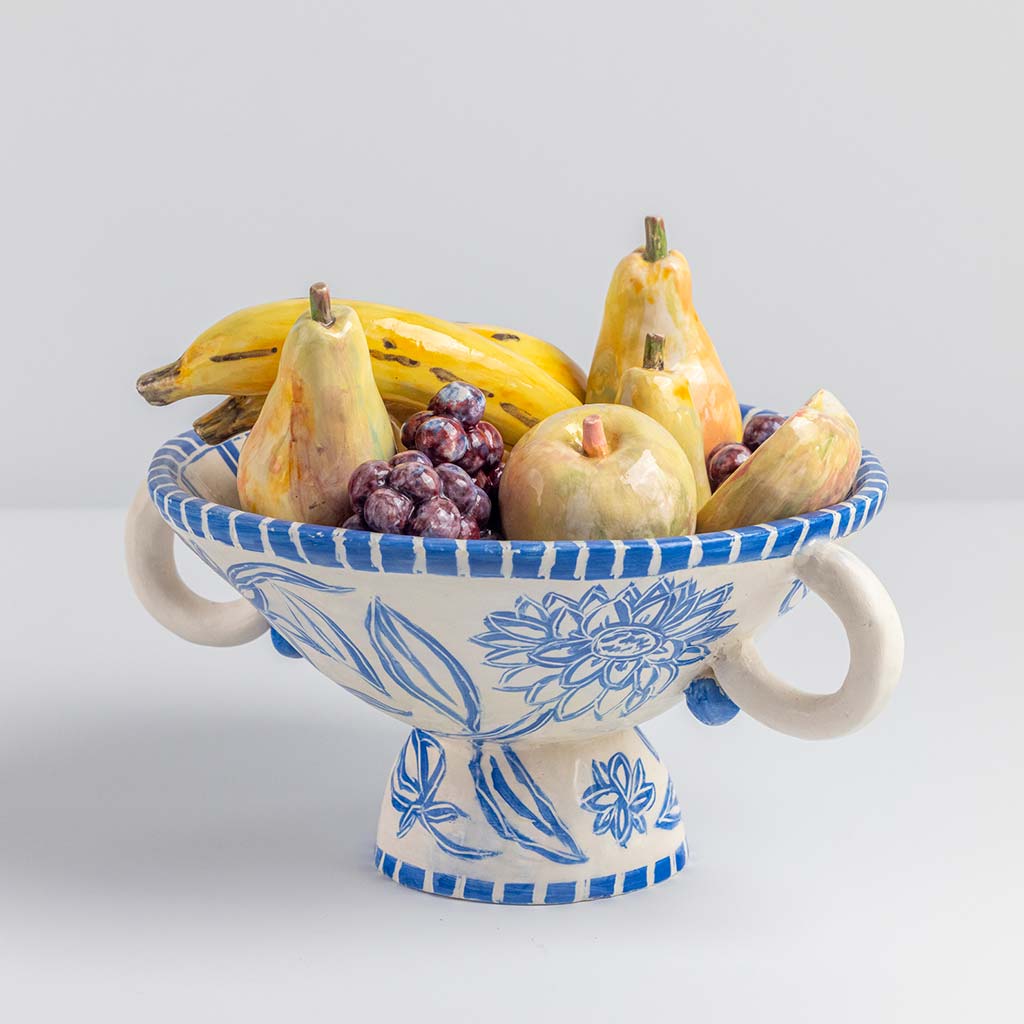 Ceramic still life of a fruit bowl with bananas, handmade and painted in a unique & colourful style by Spanish artist Maite Morell.