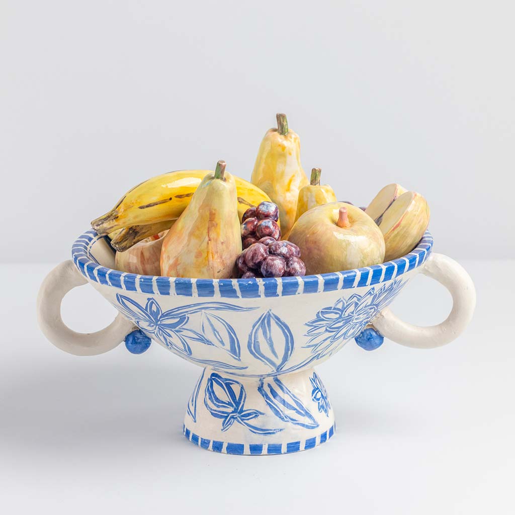 Ceramic still life of a fruit bowl with bananas, handmade and painted in a unique & colourful style by Spanish artist Maite Morell.