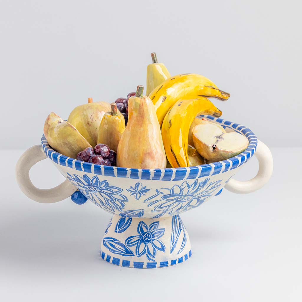 Ceramic still life of a fruit bowl with bananas, handmade and painted in a unique & colourful style by Spanish artist Maite Morell.