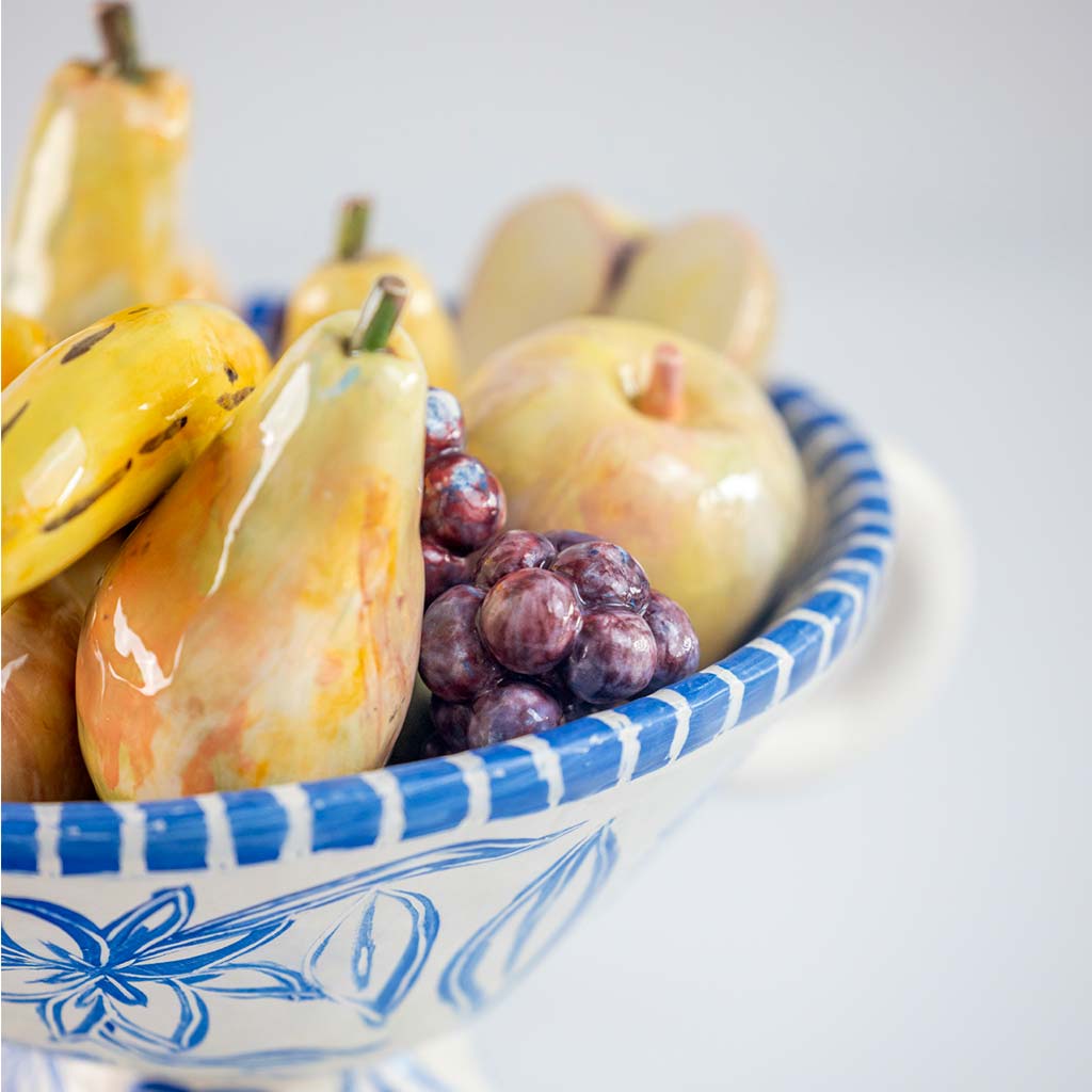 Ceramic still life of a fruit bowl with bananas, handmade and painted in a unique & colourful style by Spanish artist Maite Morell.