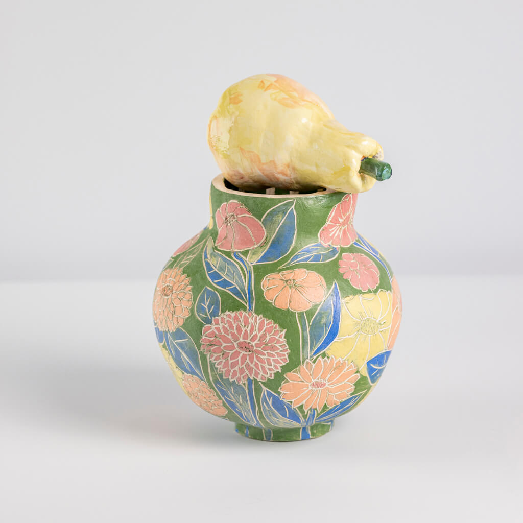 Ceramic still life of a green vase and yellow pear, handmade and painted in a unique & colourful style by Spanish artist Maite Morell.