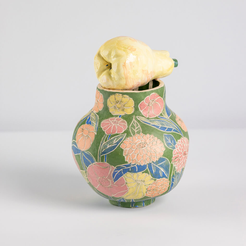 Ceramic still life of a green vase and yellow pear, handmade and painted in a unique & colourful style by Spanish artist Maite Morell.
