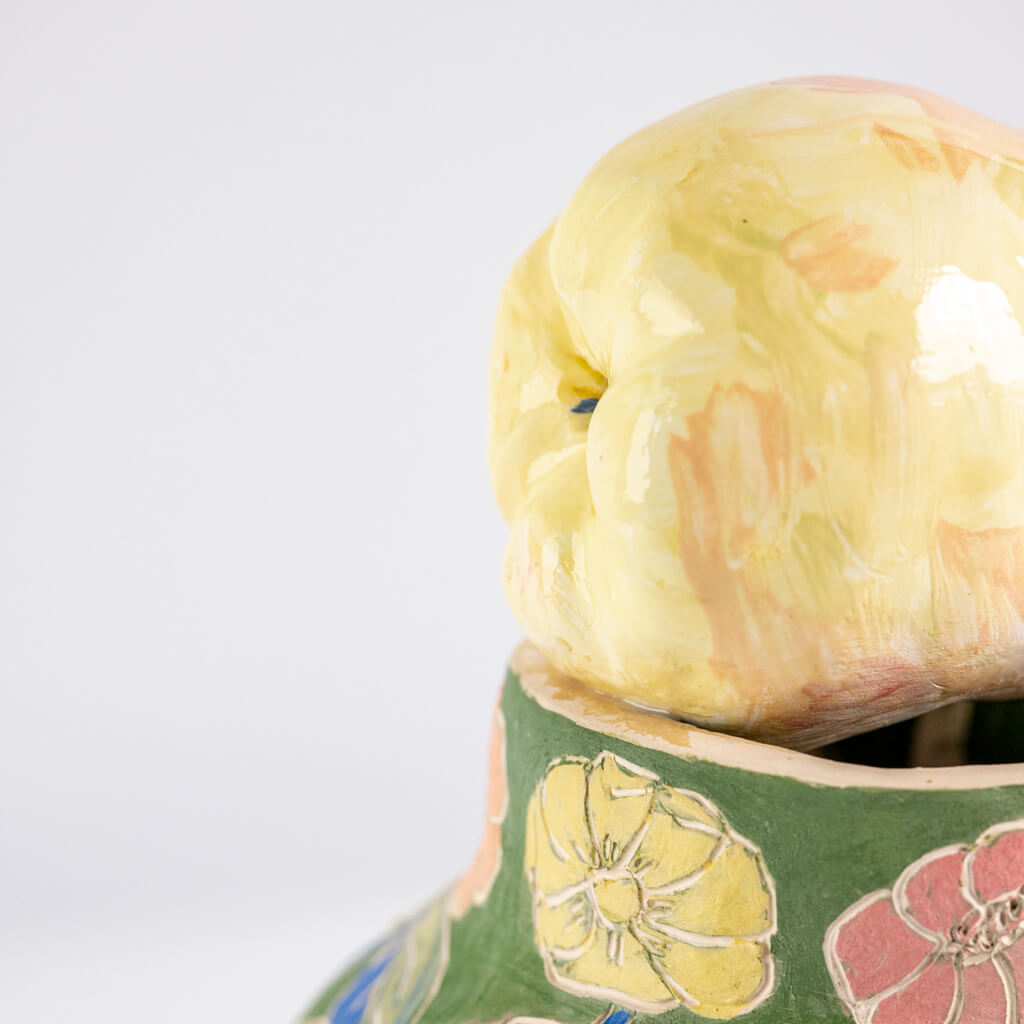 Ceramic still life of a green vase and yellow pear, handmade and painted in a unique & colourful style by Spanish artist Maite Morell.