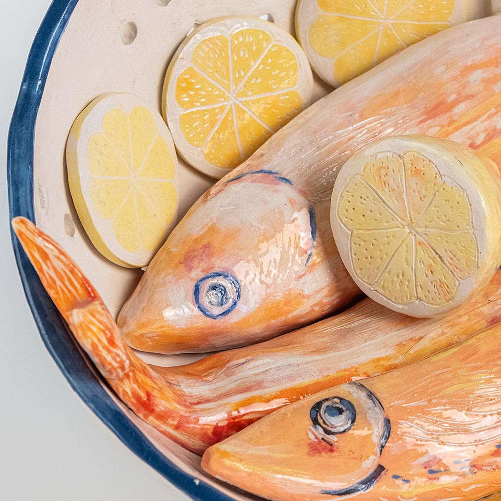 Ceramic still life with mullets and lemon, handmade and painted in a unique style by Spanish artist Maite Morell.