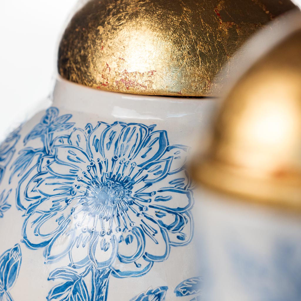 Ceramic large vase with blue camellias on white background and gold lid, handmade and painted in a unique style by Spanish artist Maite Morell.