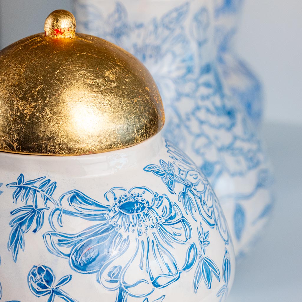 Ceramic large vase with blue camellias on white background and gold lid, handmade and painted in a unique style by Spanish artist Maite Morell.