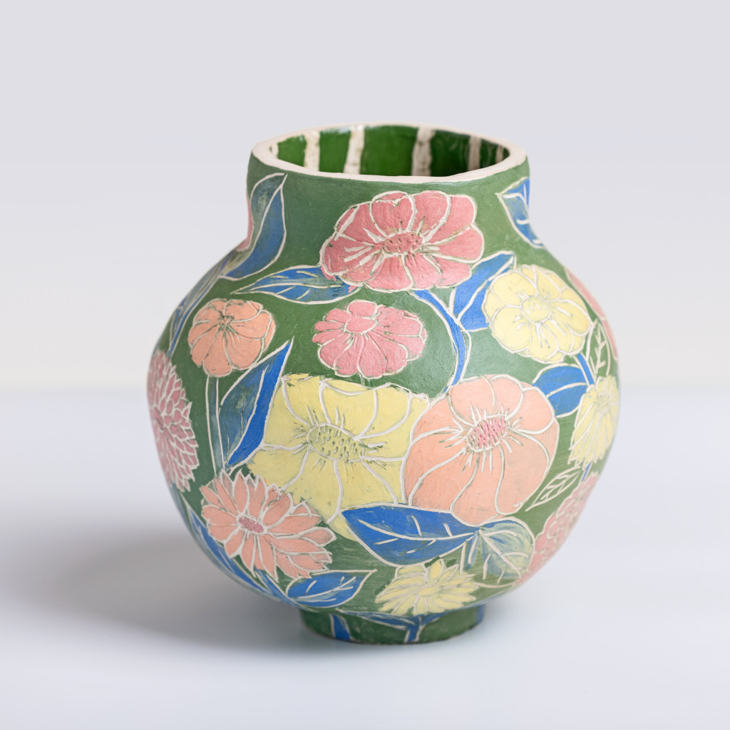 Ceramic vase with colorful flowers on matte green background, handmade and painted in a unique style by Spanish artist Maite Morell.