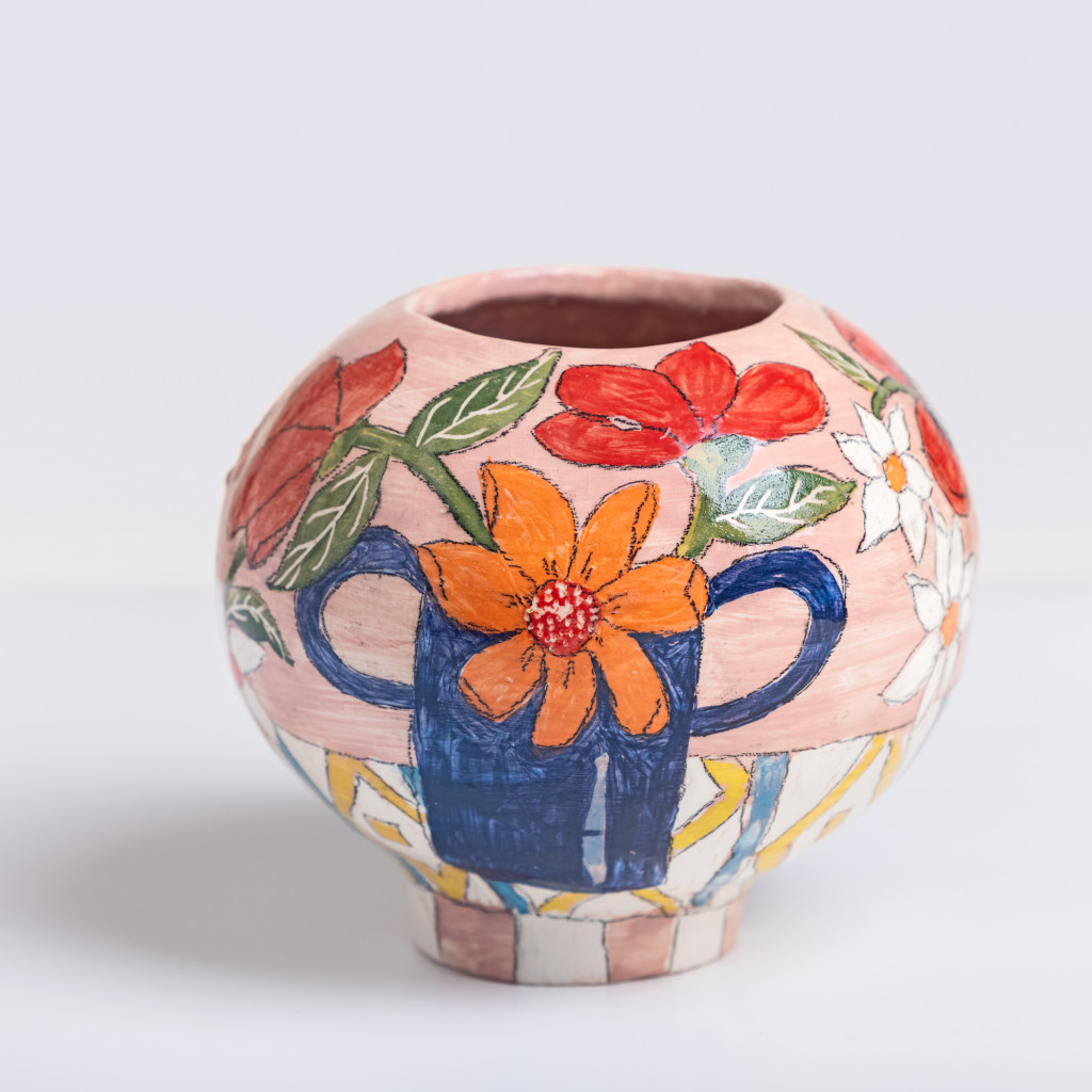 Ceramic vase with still life of a vase with flowers on pink background, handmade and painted in a unique & colourful style by Spanish artist Maite Morell.