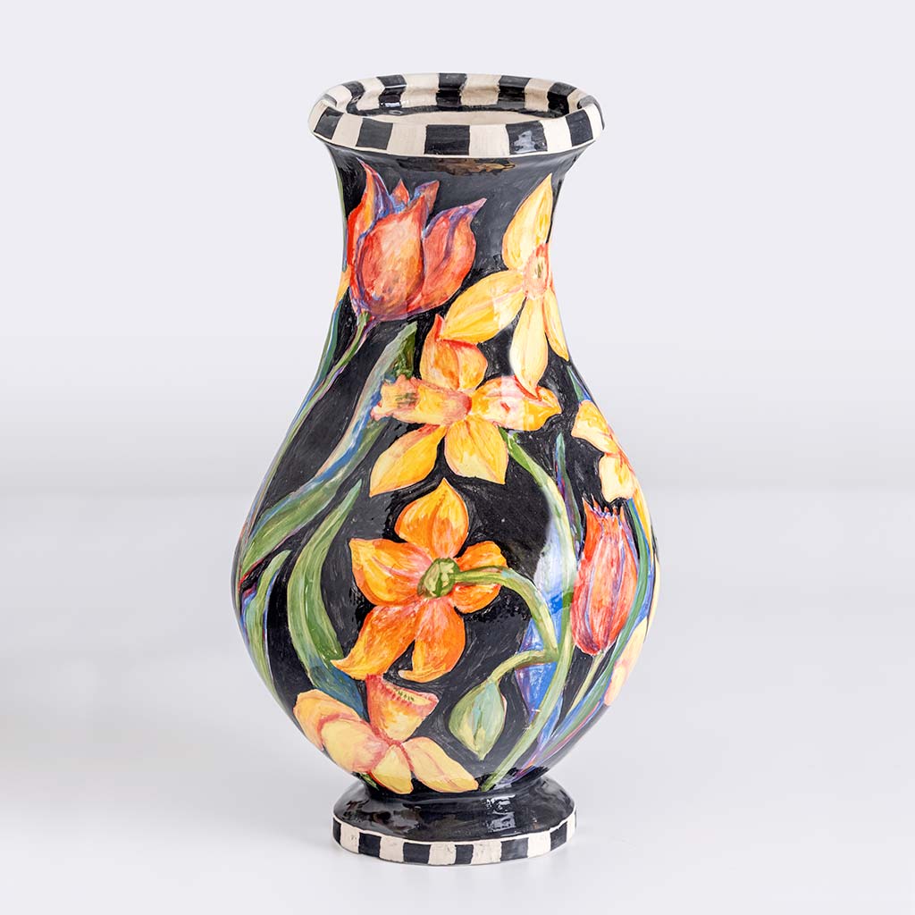 Ceramic vase with tulips and daffodils on black background, handmade and painted in a unique style by Spanish artist Maite Morell.