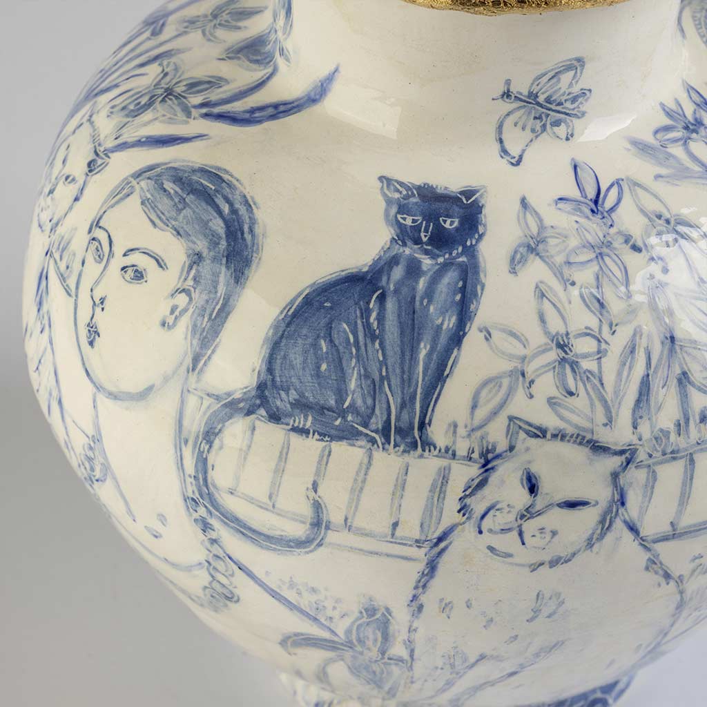 Ceramic large vase with self-portrait and black cat whiskers on white background and gold lid, handmade and painted in a unique style by Spanish artist Maite Morell.