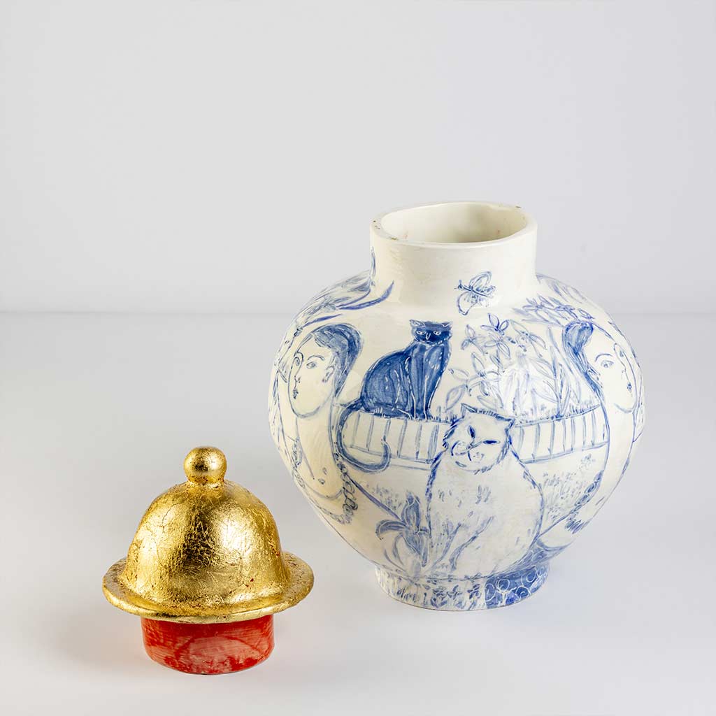 Ceramic large vase with self-portrait and black cat whiskers on white background and gold lid, handmade and painted in a unique style by Spanish artist Maite Morell.