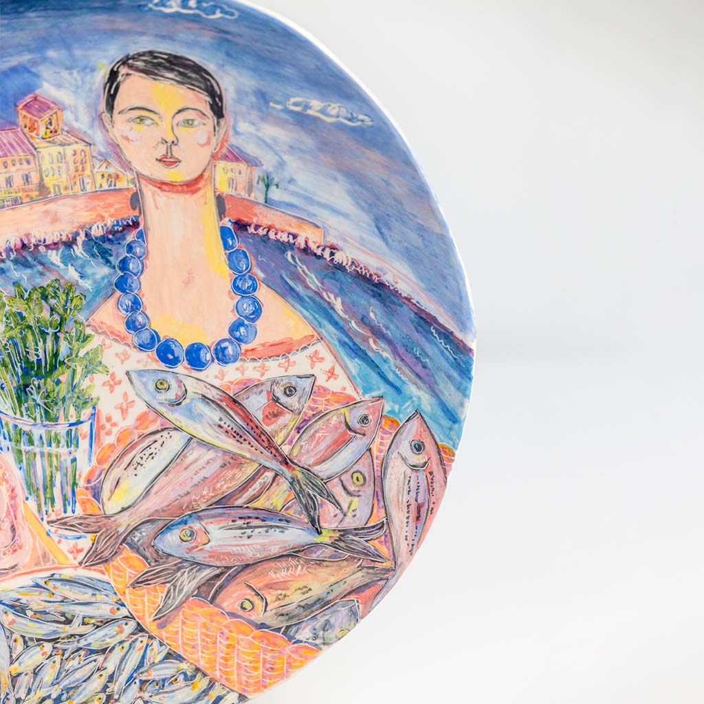 Ceramic plate with self portrait and fish with parsley in Ortigia, handmade and painted in a unique & colourful style by Spanish artist Maite Morell.