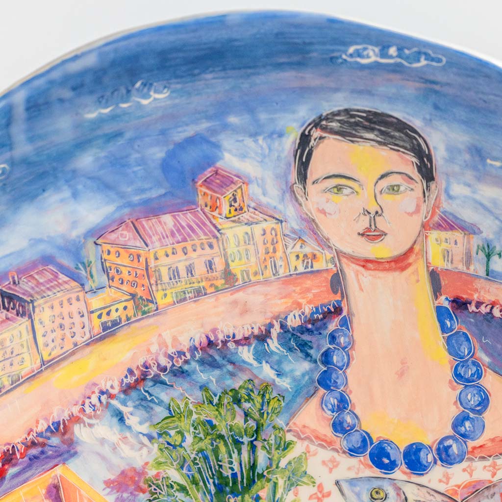 Ceramic plate with self portrait and fish with parsley in Ortigia, handmade and painted in a unique & colourful style by Spanish artist Maite Morell.