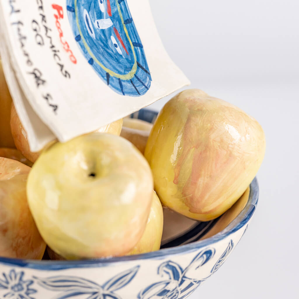 Ceramic still life of a fruit bowl, apples and a Picasso ceramics book, handmade and painted in a unique & colourful style by Spanish artist Maite Morell.